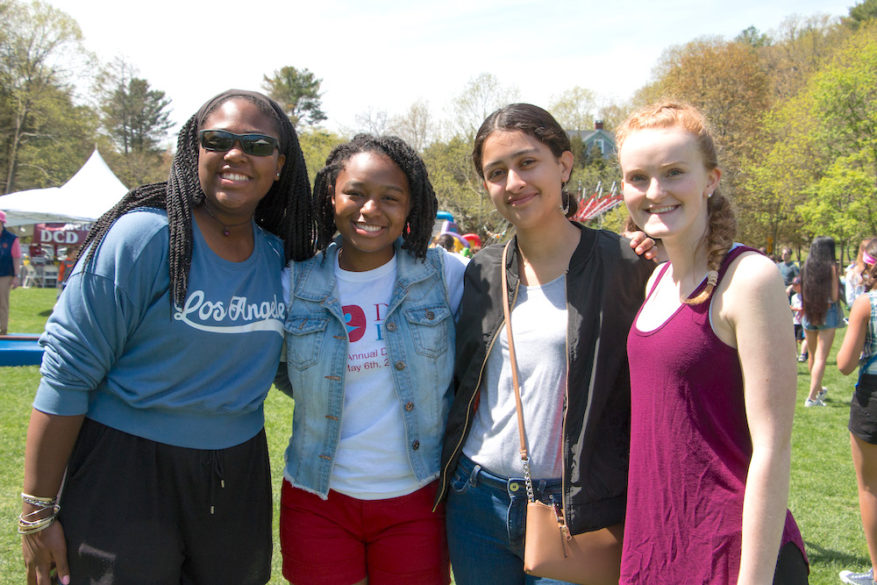 Students posing for the camera at the alumni fair