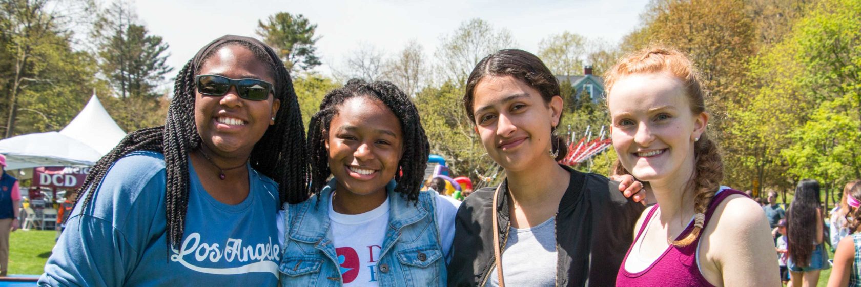 A group of alumni smiling at the camera at an event