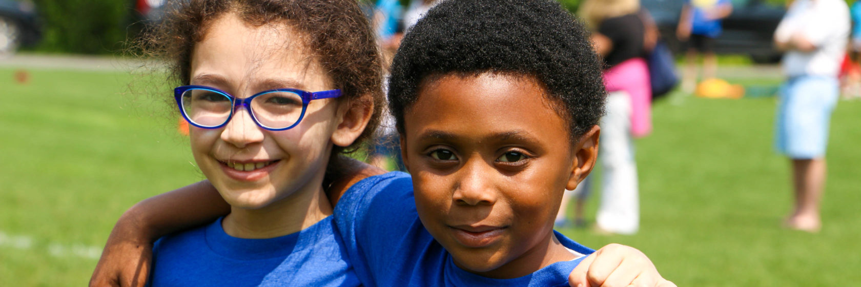 Students smiling at the camera
