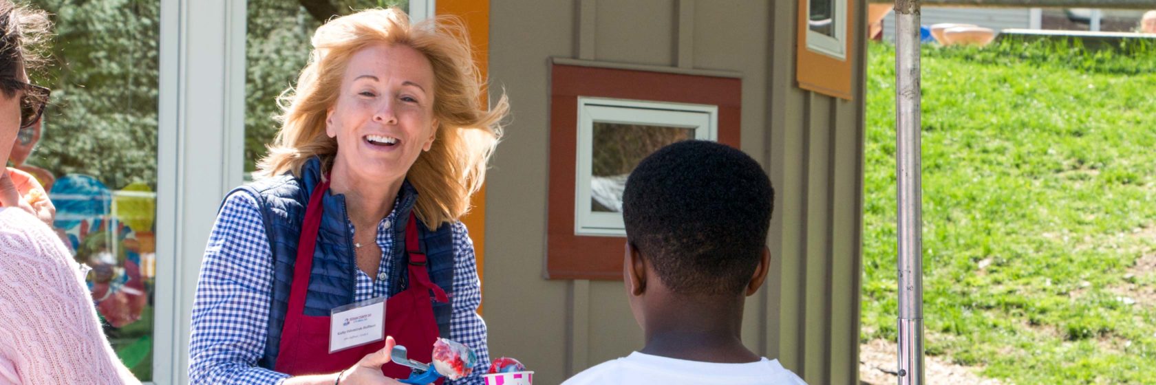 A parent volunteering at an event