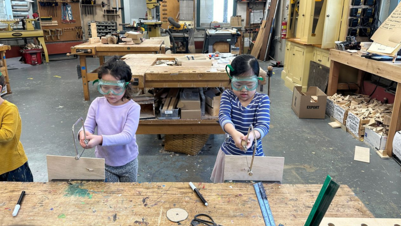 PreK Students working in the woodshop